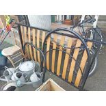 A black painted metal single bedstead comprising headboard, footboard and wooden slatted base - sold