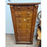 A 48.5cm late Victorian stained oak Wellington chest with flight of seven bracket locking drawers