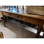 A 2.1m antique oak four plank top table with long frieze drawer to one side, set on heavy turned