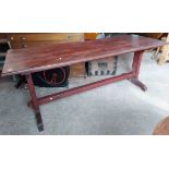 A 1.9m vintage stained pine refectory table, set on canted standard ends with pegged stretcher