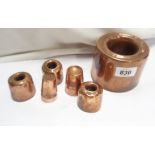 A Victorian copper jelly mould of tall ring form - sold with three smaller similar and a small