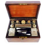 An Asprey's Victorian brass bound rosewood travelling toilet case with all original silver gilt