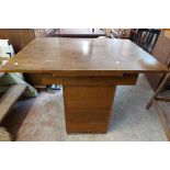 An 84cm 1930's draw-leaf dining table with burr walnut book-matched veneer to top, set on large