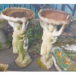 A pair of 92cm high concrete statuesque birdbaths, the pillars in the form of classical maidens