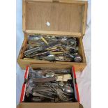 A wooden box containing a large quantity of assorted silver plated and other cutlery, telescopic