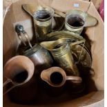 A box containing a quantity of assorted brass and copperware including jugs, trays, etc.