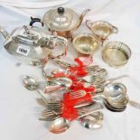 A silver plated three piece tea set, teapot and quantity of assorted plated cutlery
