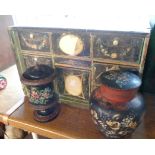 An antique wooden drawer unit with applied painted and printed drawer fronts (for restoration) -