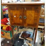 A 61cm antique inlaid mahogany sewing work cabinet with lift-top enclosing a fitted interior and two