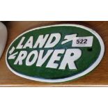 A modern painted cast iron Land Rover sign