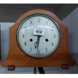 A vintage oak cased mantel clock with Enfield eight day gong striking movement