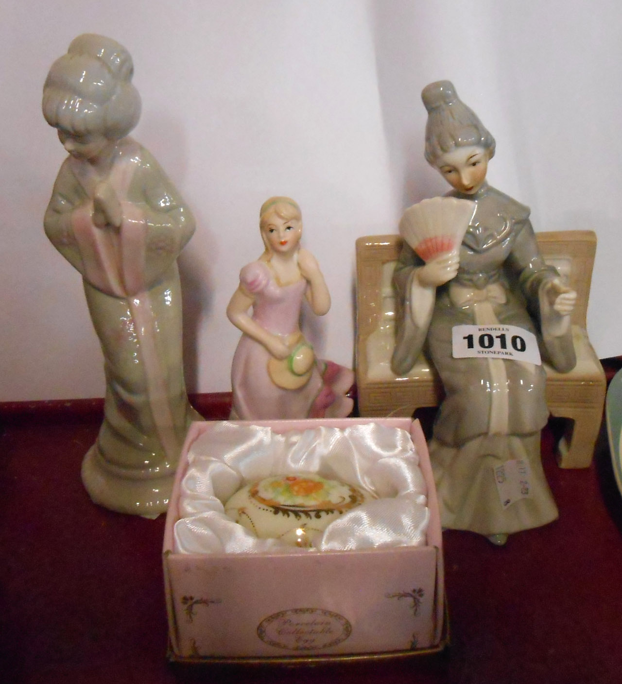 A small selection of ceramic items comprising two porcelain figures depicting Japanese ladies, a