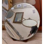 A vintage frameless bevelled circular dressing table mirror with easel back