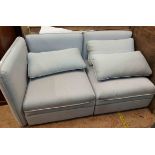 A 1.6m Ikea two section settee with lift-up locker seats and grey upholstery