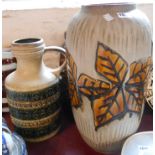 A large vintage West German pottery vase with moulded leaf decoration on a textured and matte