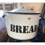 A vintage enamel bread bin and lid with stencilled lettering - sold with an unmarked smaller similar