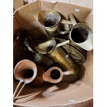 A box containing a quantity of assorted brass and copperware including jugs, trays, etc. - sold with