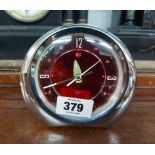 A vintage Diamond Brand chrome plated framed alarm clock with red dial