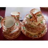 A late 19th Century Wellington china part tea set comprising eight trios, bread and butter plate and