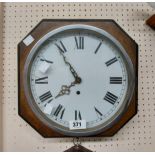 A vintage oak cased wall timepiece with simple spring driven movement