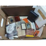 A box containing a quantity of assorted ephemera including two leather cased portrait ambrotypes,