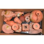 A box containing a quantity of Torquay painted terracotta ware including jugs, wall hangings, vases,