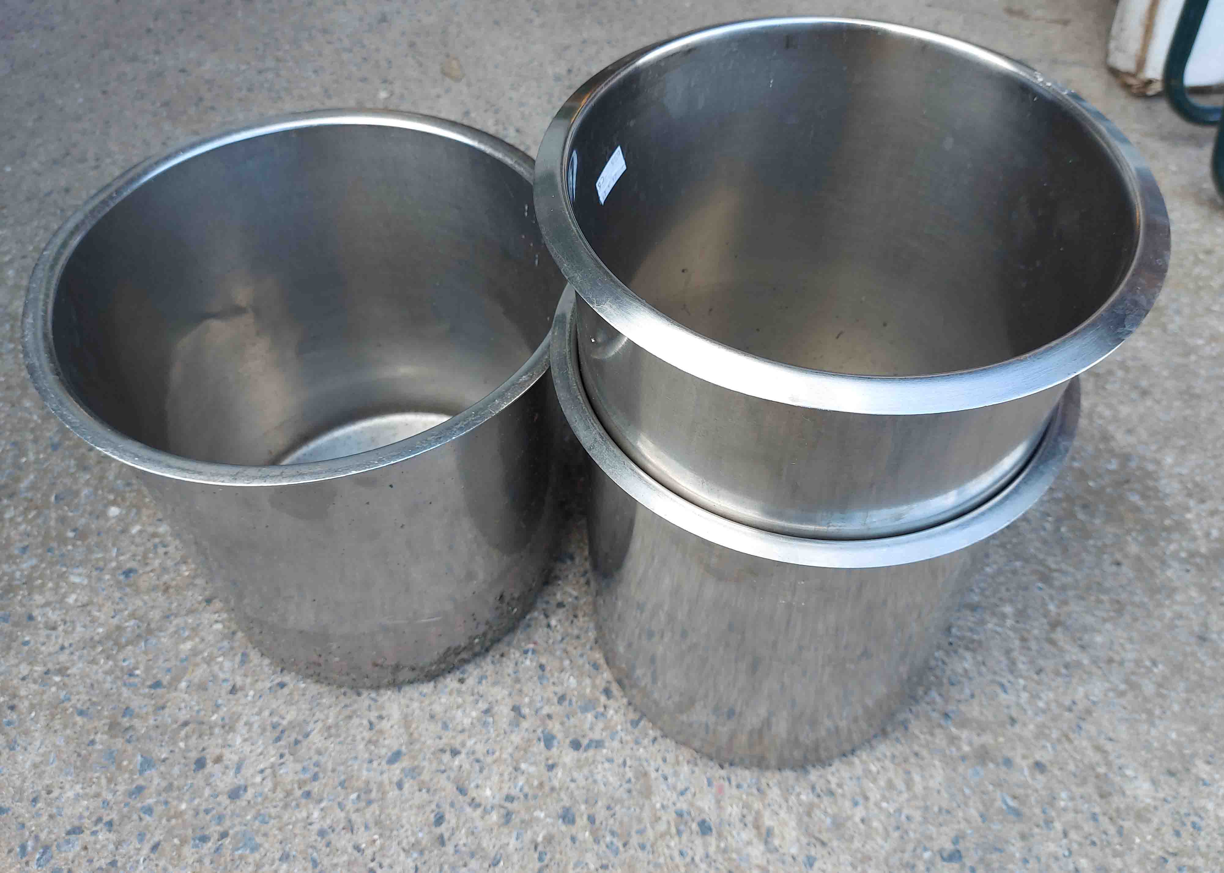 Three stainless steel litter bins