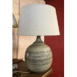 A KP Studio Pottery (Cornwall) table lamp of globe form with ribbed thrown line decoration with