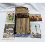A shoe box containing a collection of early 20th Century and later postcards including numerous