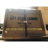A vintage cardboard laundry box marked for The City Steam Laundry, Exeter
