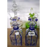 A pair of 19th Century blue glass overlay flash cut decanters - sold with two claret jug style