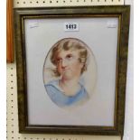 A later framed oval watercolour portrait of a child - signed and dated 1875