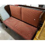 A 1.37m vintage stained mixed wood public house wingback settle with repeat diamond pattern tapestry