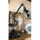 A modern anglepoise style adjustable desk lamp with black painted finish