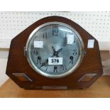 A vintage stained oak cased mantel clock with Enfield eight day chiming movement