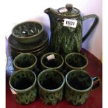 A vintage Kernewek Cornish pottery part coffee set with mottled green glaze decoration comprising