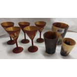 A set of five red lacquer wine glasses of stemmed funnel form with gilt bird decoration - sold