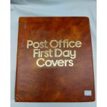 A brown ring bound album containing a collection of sleeve mounted FDCs, dating from 1969 to 1975