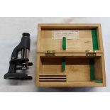 A vintage portable microscope in fitted wooden box marked F.A. Thiele, Kobenhavn