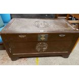 A 100cm 20th Century Chinese (Hong Kong) camphor wood chest with motifs to lift-top and front, set