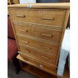 A 65cm modern wood and rattan faced chest of four drawers, set on plinth base