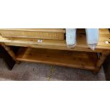 A 1.05m modern pine two tier coffee table, set on turned supports