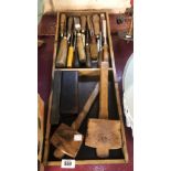 A wooden tray containing a quantity of old tools including chisels, mallets, etc.