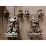 A pair of cast brass twin branch candelabra of Rococo form with gryphon mounts