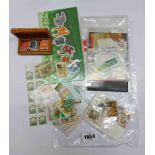 A small collection of GB and world stamps, also an Italian carved wood stamp case with 'Tarvis' (