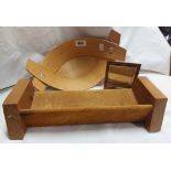 A 20th Century elm book trough with leather covering and a small burr elm mirror from the workshop