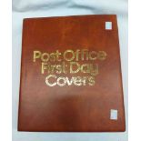 A brown ring bound album containing a collection of sleeve mounted FDCs from mid 1970's to early