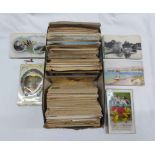 A shoe box containing a collection of early 20th Century and later postcards including