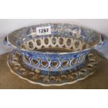 An early 19th Century pearlware blue and white transfer printed chestnut basket stand with