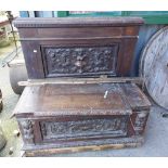 A Victorian carved oak lift-top locker box with high back and decorative panels - a/f and woodworm